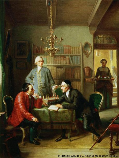 Painting that shows two men seated at a table, another watches them, a woman enters with a tray, Lessing und Lavater visitng Moses Mendelssohn