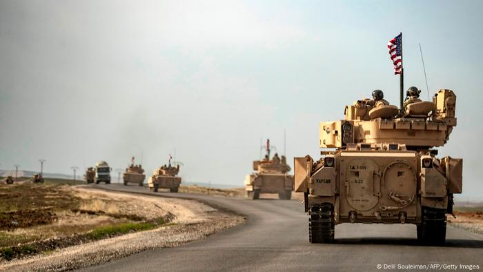 US troops ride Bradley tanks on patrol near Iraq's border with Syria