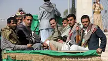 FILE PHOTO: Armed Houthi followers ride on the back of a truck after participating in a funeral of Houthi fighters killed in recent fighting against government forces in Yemen's oil-rich province of Marib, in Sanaa, Yemen February 20, 2021. REUTERS/Khaled Abdullah/File Photo/File Photo