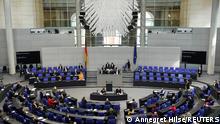 German Chancellor Angela Merkel stands during a plenum session of the lower house of parliament, the Bundestag, in Berlin, Germany, March 24, 2021. REUTERS/Annegret Hilse