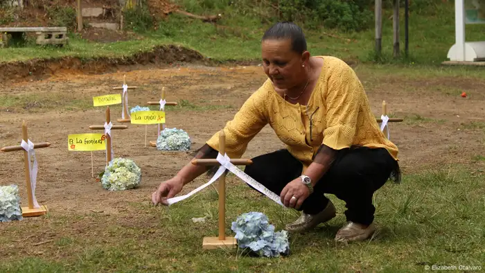 Gertrudis Nieto at the tomb of her son.