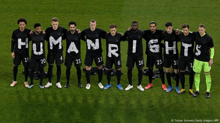 Germany's players pose for a group photo with the wording Human rights on their T-shirts prior to the FIFA World Cup Qatar 2022 qualification football match Germany v Iceland in Duisburg on March 25, 2021.