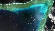 TOPSHOT - This handout satellite imagery taken on March 23, 2021 and received on March 25 from Maxar Technologies shows Chinese vessels anchored at the Whitsun Reef, around 320 kilometres (175 nautical miles) west of Bataraza in Palawan in the South China Sea. - Chinese vessels gathered near a disputed reef in the South China Sea are fishing boats sheltering from poor weather, the foreign ministry said March 22, a day after the Philippines described their presence as an incursion. (Photo by Handout / Satellite image ©2021 Maxar Technologies / AFP) / THE WATERMARK MAY NOT BE REMOVED/CROPPED
-----EDITORS NOTE --- RESTRICTED TO EDITORIAL USE - MANDATORY CREDIT AFP PHOTO / Satellite image ©2021 Maxar Technologies - NO MARKETING - NO ADVERTISING CAMPAIGNS - DISTRIBUTED AS A SERVICE TO CLIENTS