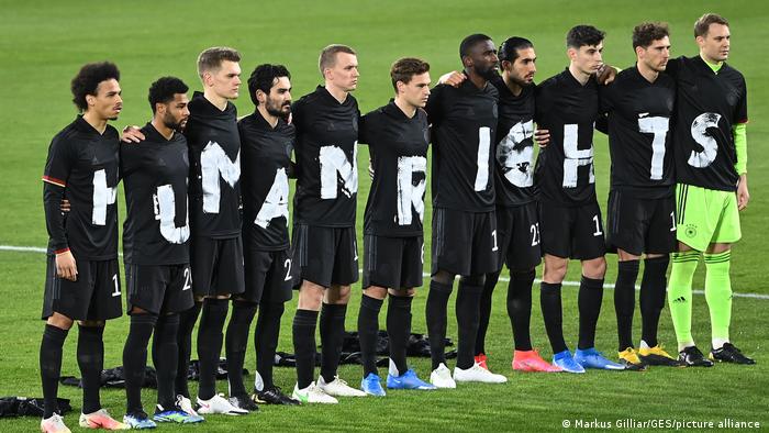 Germany players wear t-shirts bearing the words 'Human Rights' ahead of a World Cup qualifier