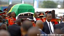 CHATO, TANZANIA - MARCH 26: President Magufuli’s coffin arrives for the final service before a private burial on March 26, 2021 in Chato, Tanzania. The country has held a series of services to mourn the late president that culminates with his burial in his hometown of Chato. President Magufuli died last week after having gone several weeks without public appearances. Tanzanian officials said the cause of death was heart disease. (Photo by Luke Dray/Getty Images)