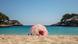 Spain, Mallorca: people under a parasol on an empty beach Spain, Mallorca: people under a parasol on an empty beach