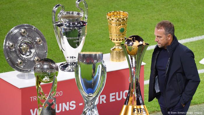 Hansi Flick with six trophies
