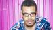 Ron Iyamu vor einem pinken Hintergrund. Ron Iyamu vor einem pinken Hintergrund.