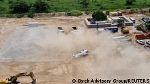 A Dyck Advisory Group helicopter lands in Palma, Mozambique in this picture taken between March 24 and March 27, 2021 and obtained by Reuters on March 30, 2021. Dyck Advisory Group/Handout via REUTERS THIS IMAGE HAS BEEN SUPPLIED BY A THIRD PARTY. MANDATORY CREDIT.