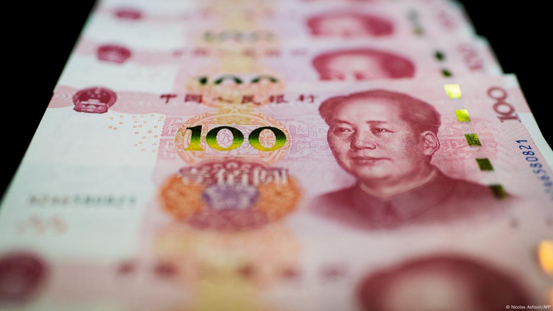This photo illustration shows Chinese 100 yuan notes in Beijing on January 14, 2020