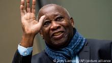 Former Ivory Coast president Laurent Gbagbo greets supporters attending the court session at the International Criminal Court in The Hague, Netherlands, Thursday, Feb. 6, 2020. The ICC hears an appeal by Gbagbo against conditions imposed on him and a former government minister during their release from custody pending prosecutors' appeal against their acquittals on crimes against humanity charges. (AP Photo/Jerry Lampen, Pool)