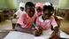 School children write in a book School children write in a book