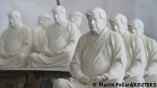 Statues depicting former U.S. President Donald Trump in a Buddhist meditative pose, by Chinese designer Hong Jinshi, are seen at a workshop in Dehua, Fujian province, China March 24, 2021. Picture taken March 24, 2021. REUTERS/Martin Pollard