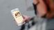 A young girl posting her picture with a sign reading "Where Is Everyone?" on Twitter in a street. A young girl posting her picture with a sign reading "Where Is Everyone?" on Twitter in a street.