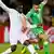 England's Emile Heskey, left, competes for the ball with Algeria's Riad Boudebouz