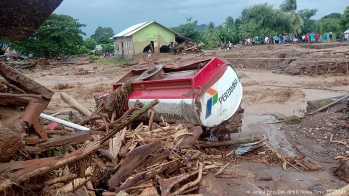 A damaged truck is seen at an area affected by flash floods after heavy rains in East Flores, East Nusa Tenggara province, Indonesia 