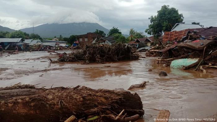 Damaged houses are seen at an area affected by flash floods after heavy rains in East Flores, Indonesia