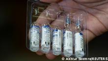 A paramedic holds a pack of used and unused vials of Russia's Sputnik V coronavirus disease (COVID-19) vaccine at a private hospital in Karachi, Pakistan April 4, 2021. REUTERS/Akhtar Soomro