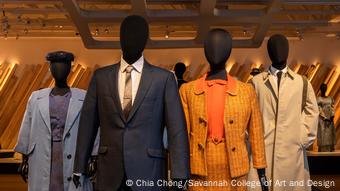 Four black mannequins wear costumes from the film Selma that are borrowed from 1960s fashion, such as an orange costume with a waist-high skirt. Four black mannequins wear costumes from the film Selma that are borrowed from 1960s fashion, such as an orange costume with a waist-high skirt.