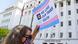 A woman holding up a sign that reads "We Love Our Trans Youth" during a rally at the Alabama State House in Montgomery A woman holding up a sign that reads "We Love Our Trans Youth" during a rally at the Alabama State House in Montgomery