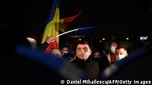 George Simion, the leader and parliament member of nationalist party AUR (The Alliance for the Unity of Romanians) looks on during a protest against the health ministry, in downtown Bucharest, on January 30, 2021. - Romania was in shock on January 29 after a fire broke out in the country's main hospital for coronavirus patients, killing five in the second such incident in three months. In November, a fire in an intensive care unit of a hospital in the northeastern town of Piatra Neamt killed 15 people being treated for Covid-19. (Photo by Daniel MIHAILESCU / AFP) (Photo by DANIEL MIHAILESCU/AFP via Getty Images)