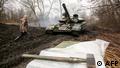 Ukrainian servicemen work on their tank close to the front line with Russian-backed separatists near Lysychansk, Lugansk region on April 7, 2021