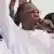 Idriss Deby waves at supporters during a campaign rally