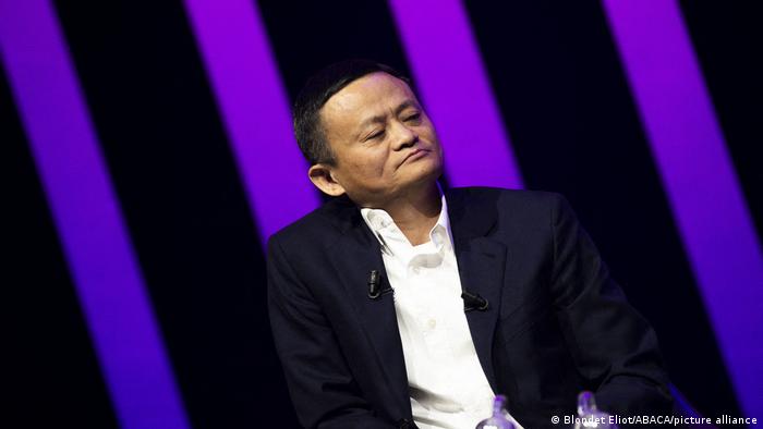 Jack Ma in a black blazer and white button.up shirt