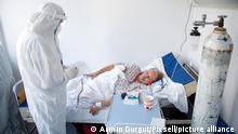 A medical worker treats a patient suffering from the coronavirus disease (COVID-19) at the General Hospital COVID-19 ward in Sarajevo, Bosnia and Herzegovina April 2; 2021. Hospital is running critically short of intensive care beds and respirators for treating COVID-19 patitents. Photo: Armin Durgut/PIXSELL