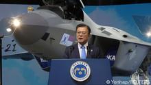 South Korean President Moon Jae-in delivers his speech in front of a prototype of the country's first homegrown fighter jet called KF-21 during its rollout ceremony in Sacheon, South Korea, April 9, 2021. Yonhap via REUTERS ATTENTION EDITORS - THIS IMAGE HAS BEEN SUPPLIED BY A THIRD PARTY. SOUTH KOREA OUT. NO RESALES. NO ARCHIVE.