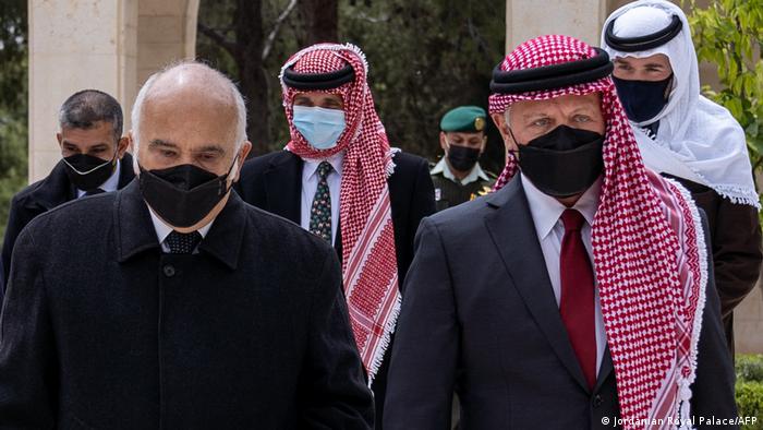 A handout picture released by the Jordanian Royal Palace on April 11, 2021 shows Jordanian King Abdullah II (R), Prince Hassan Bin Talal (L) and Prince Hamzah (C) arriving at the Raghadan Palace in the capital Jordan.