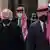 A handout picture released by the Jordanian Royal Palace on April 11, 2021 shows Jordanian King Abdullah II (R), Prince Hassan Bin Talal (L) and Prince Hamzah (C) arriving at the Raghadan Palace in the capital Jordan.