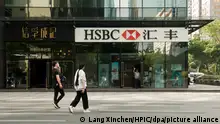 --FILE--Pedestrians walk past a branch of HSBC (the Hongkong and Shanghai Banking Corporation Limited) in Guangzhou city, south China's Guangdong province, 9 November 2018. A Chinese lawyer has urged Shanghai police to investigate the alleged illegal role of a Chinese subsidiary of UK-based banking giant HSBC in the arrest in Canada of Meng Wanzhou, chief financial officer of China's Huawei. Lawyer Li Mingqiang said in a public letter to the Shanghai police on Monday that HSBC Bank (China) Co Ltd, an HSBC subsidiary, had exposed Huawei trade secrets and breached a convention that a China-registered business entity should first report any suspected wrongdoings by its clients to Chinese authorities, instead of foreign ones. Li said in the letter that information revealed to public so far clearly shows that HSBC has disclosed, on its own initiative, trade secrets belonging to Huawei, the bank's client, to foreign governments. According to a story in the Wall Street Journal, a monitor appointed by the US government to oversee HSBC's anti money-laundering controls flagged illicit transactions made by Huawei at the bank and shared them with New York prosecutors. That led to the arrest of Meng.