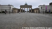 TOPSHOT - The near-empty Pariser Platz square in front of Berlin's landmark Brandenburg Gate (Brandenburger Tor) is pictured on January 22, 2021, during the ongoing novel coronavirus (Covid-19) pandemic. - Europe's top economy Germany this week extended its partial lockdown until February 14, 2021 and Chancellor Merkel has not ruled out border checks to slow the spread of the new strains. (Photo by Tobias Schwarz / AFP) (Photo by TOBIAS SCHWARZ/AFP via Getty Images)