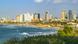 A sunny aerial view of the Tel Aviv cityscape and beach. A sunny aerial view of the Tel Aviv cityscape and beach.