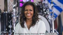 FILE - In this Oct. 11, 2018 file photo, Michelle Obama participates in the International Day of the Girl on NBC's Today show in New York. Oprah Winfrey and Reese Witherspoon will be among the special guests when Michelle Obama goes on tour for her memoir “Becoming.” (Photo by Charles Sykes/Invision/AP, File) 