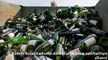 More than 500 bottles of counterfeit and unsellable wine are destroyed at the Texas Disposal Systems recycling and compost facility in Austin, Texas, on Thursday, Dec. 10, 2015. The wine is from the Rudy Kurniawan case, the man convicted of fraud in federal court in 2013 for producing and selling millions of dollars of counterfeit wine. (Rodolfo Gonzalez/Austin American-Statesman via AP) AUSTIN CHRONICLE OUT, COMMUNITY IMPACT OUT, INTERNET AND TV MUST CREDIT PHOTOGRAPHER AND STATESMAN.COM, MAGS OUT; MANDATORY CREDIT