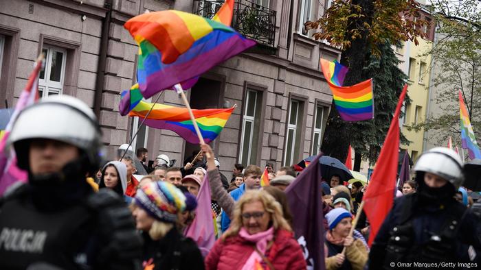 Giant rainbow flags are seen during a Pride march in Nowy Sacz, Poland