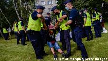 WARSAW, POLAND - AUGUST 06: Police remove a protester wearing a shirt saying love with rainbow colours as he protests during the ruling Presidents, Andrzej Duda, swearing in ceremony in front of the Parliament on August 06, 2020 in Warsaw, Poland. Growing hostility towards the LGBT community in Poland has driven a wave of protests from both sides. President Duda is said to have conducted a campaign that actively deployed anti-LGBT rhetoric as an election strategy, and calling “LGBT ideology” more dangerous than communism. Several Polish municipalities have declared their territory as LGBT-Free Zone, leading to sanctions by the European Commission. (Photo by Omar Marques/Getty Images)