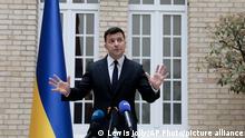 Ukrainian President Volodymyr Zelenskyy holds a press conference at the Ukrainian Embassy to France, Friday, April 16, 2021, in Paris. Ukrainian President Volodymyr Zelenskyy held talks with French President Emmanuel Macron and German Chancellor Angela Merkel amid his country's growing tensions with neighboring Russia, which has deployed troops near its border with Ukraine.(AP Photo/Lewis Joly)