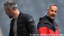 MOENCHENGLADBACH, GERMANY - APRIL 17: Marco Rose, Head Coach of Borussia Moenchengladbach speaks with Adi Huetter, Head Coach of Eintracht Frankfurt prior to the Bundesliga match between Borussia Moenchengladbach and Eintracht Frankfurt at Borussia-Park on April 17, 2021 in Moenchengladbach, Germany. Sporting stadiums around Germany remain under strict restrictions due to the Coronavirus Pandemic as Government social distancing laws prohibit fans inside venues resulting in games being played behind closed doors. (Photo by Sascha Steinbach - Pool/Getty Images)