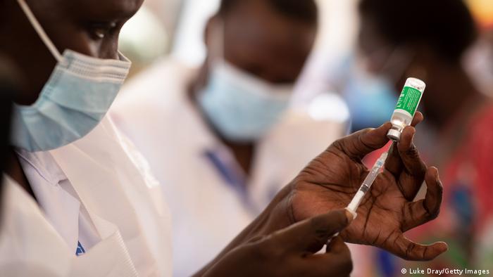 A nurse draws a vaccine dose on March 10, 2021 in Kampala, Uganda