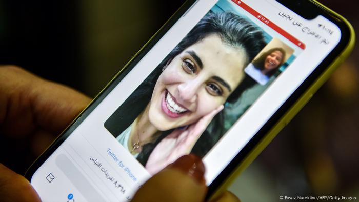 Mobile phone depicting a photo of the just released Loujain al-Hathloul in February 2021.