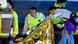 Police and rescue workers inspect a victim Police and rescue workers inspect a victim