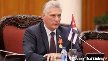 (FILES) In this file photo taken on November 09, 2018 Cuba's President Miguel Diaz-Canel Bermudez (C) speaks during a meeting with Vietnamese Prime Minister Nguyen Xuan Phuc (not pictured) at the Government Office in Hanoi. - Born after the victory of the 1959 revolution, Miguel Diaz-Canel, president and now first secretary of the Communist Party, embodies the new generation in power in Cuba, more connected but not necessarily more flexible. (Photo by LUONG THAI LINH / POOL / AFP)