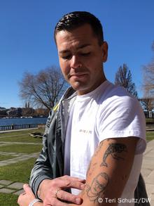 Gustav Lloyd Agerblad shows his Tegnell tattoo