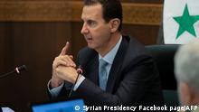 (FILES) This handout file picture released by the official Facebook page of the Syrian Presidency on March 30, 2021, shows Syrian President Bashar Al-Assad meeting with cabinet members in Damascus after announcing his recovery from Covid-19. - Syria is to hold a presidential election on May 26, the parliament speaker announced today, the country's second in the shadow of civil war, seen as likely to keep President Bashar Al-Assad in power. (Photo by - / SYRIAN PRESIDENCY FACEBOOK PAGE / AFP) / RESTRICTED TO EDITORIAL USE - MANDATORY CREDIT AFP PHOTO / Syrian Presidency Facebook page - NO MARKETING NO ADVERTISING CAMPAIGNS - DISTRIBUTED AS A SERVICE TO CLIENTS