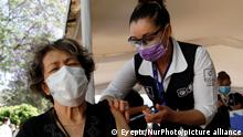 A elderly receives a second dose of Pfizer BioNTech's Covid19 during a mass vaccination to people aged 60 years and older at the headquarters of the Universidad AutÃ³noma Metropolitana campus Xochimilco. On April 19, 2021 in Mexico City, Mexico (Photo by Eyepix/NurPhoto)