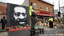 A man gestures on a bench, as the verdict announcement is expected in the trial of former Minneapolis police officer Derek Chauvin, who is facing murder charges in the death of George Floyd, at the George Floyd Square in Minneapolis, Minnesota, U.S., April 20, 2021. REUTERS/Octavio Jones