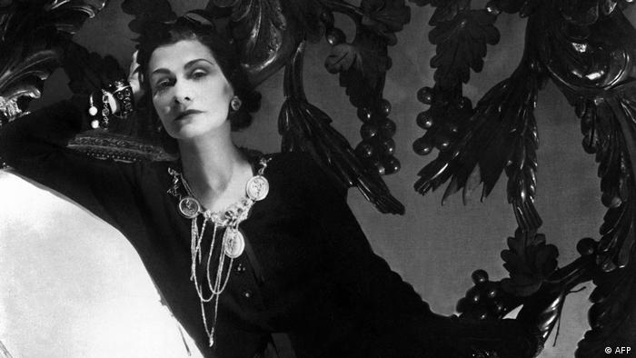 Coco Chanel in a black-and-white portrait.